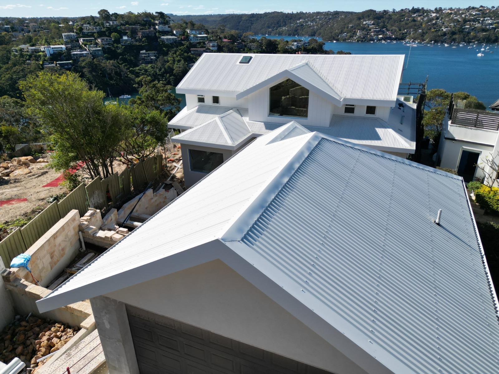 Roofing Goats — white Colorbond corrugated re-roof on Sydney waterfront home