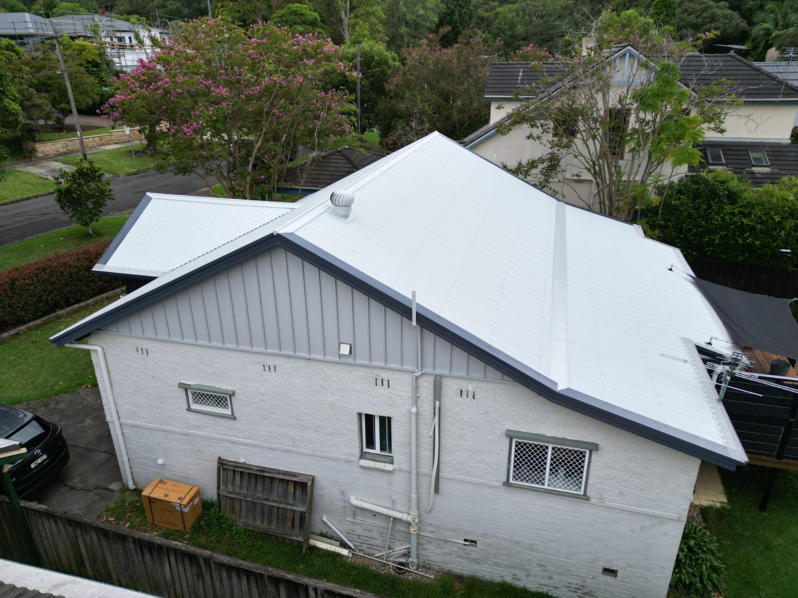 Roofing Goats — completed white Colorbond roof in leafy Sydney suburb