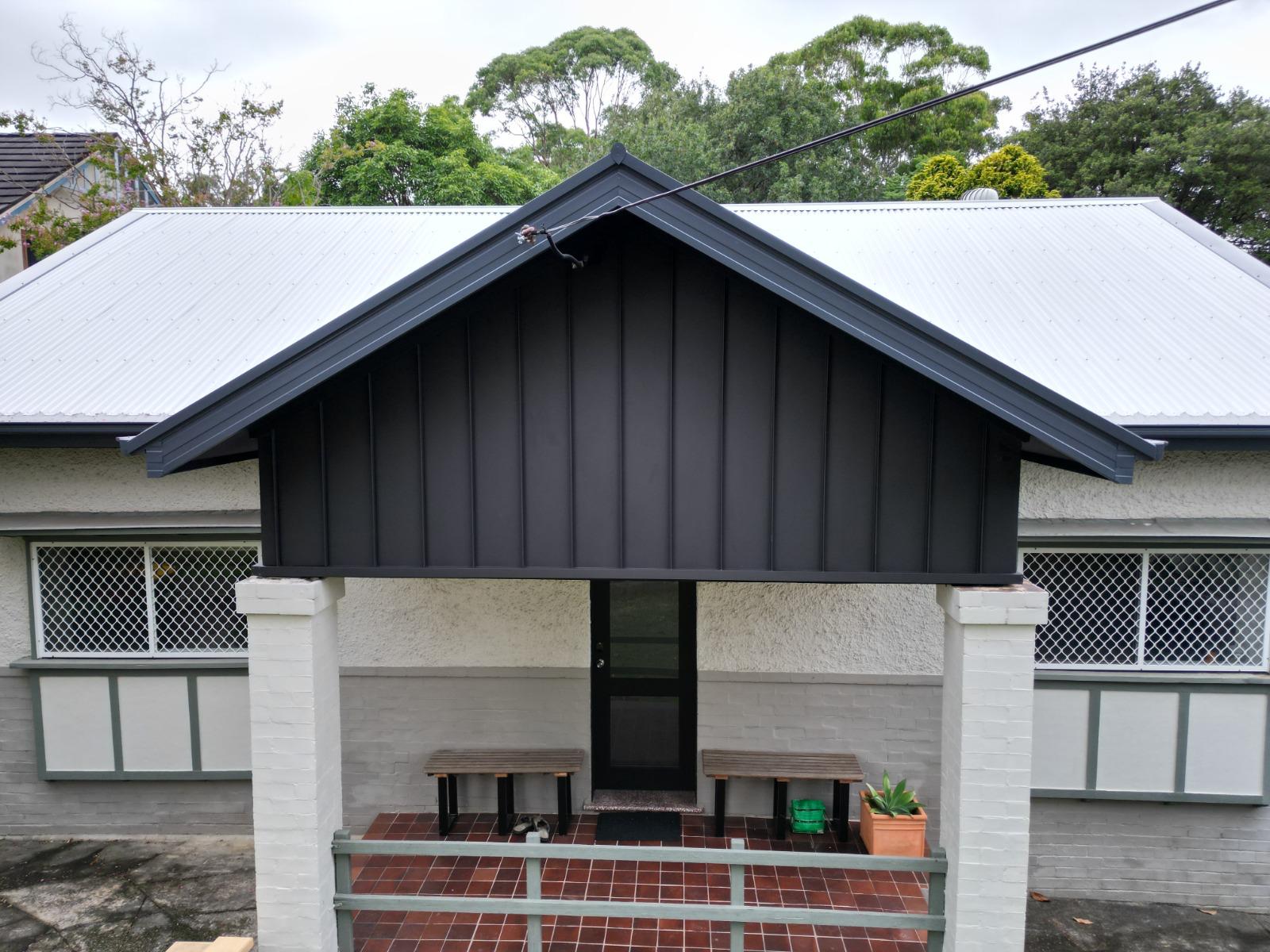 Roofing Goats — heritage Sydney home with new black COLORBOND gable feature and silver corrugated main roof