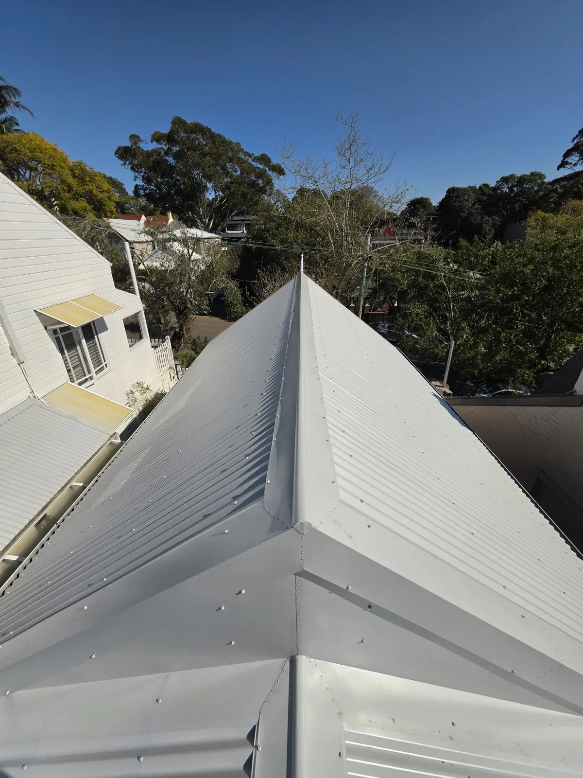 Finished ridge and roof-junction flashings at View Street, Annandale