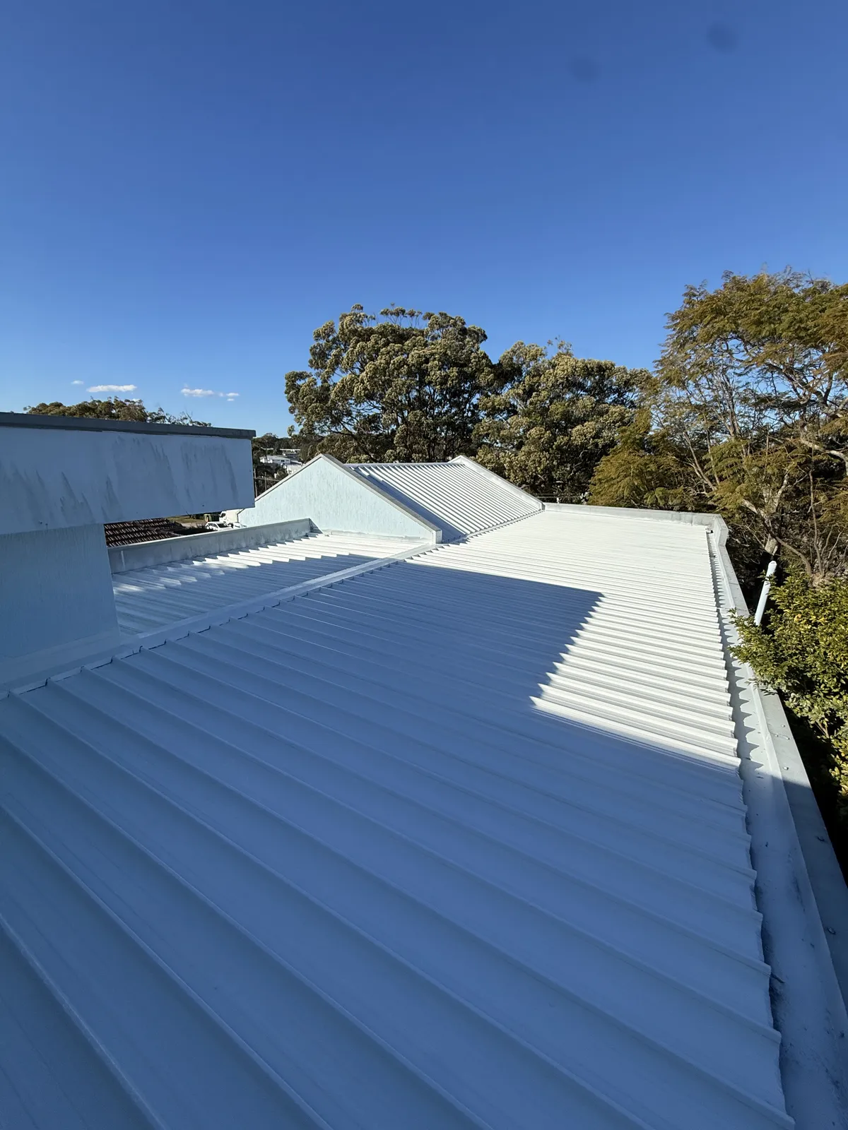 Finished metal roof junction at Parthenia Street, Dolans Bay after partial replacement and restoration