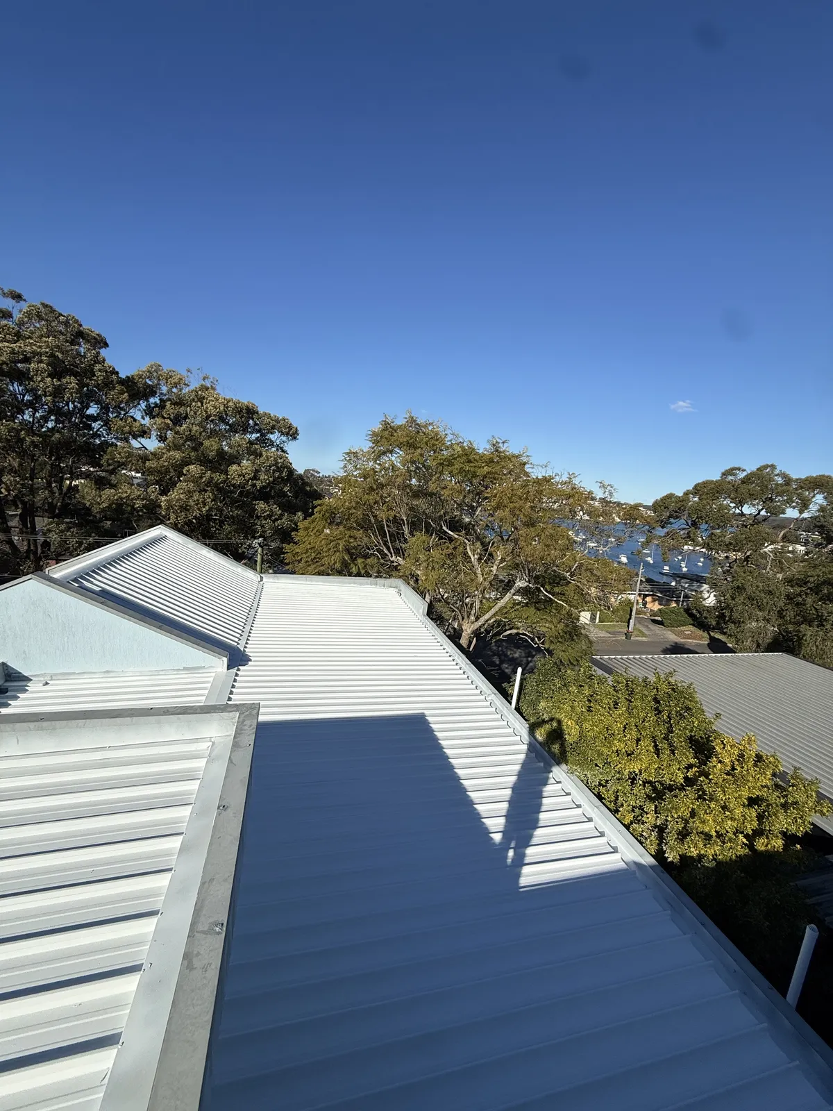 Completed roof sections and junctions on the Dolans Bay home after the roofing work