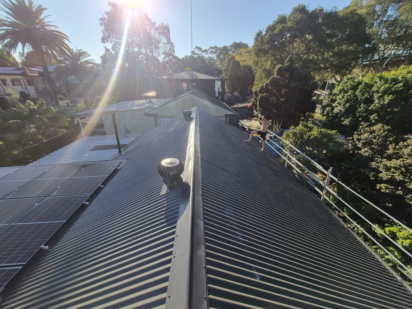 Completed ridge and roof sections beside the reinstated solar panels at Eagle Street, Ryde